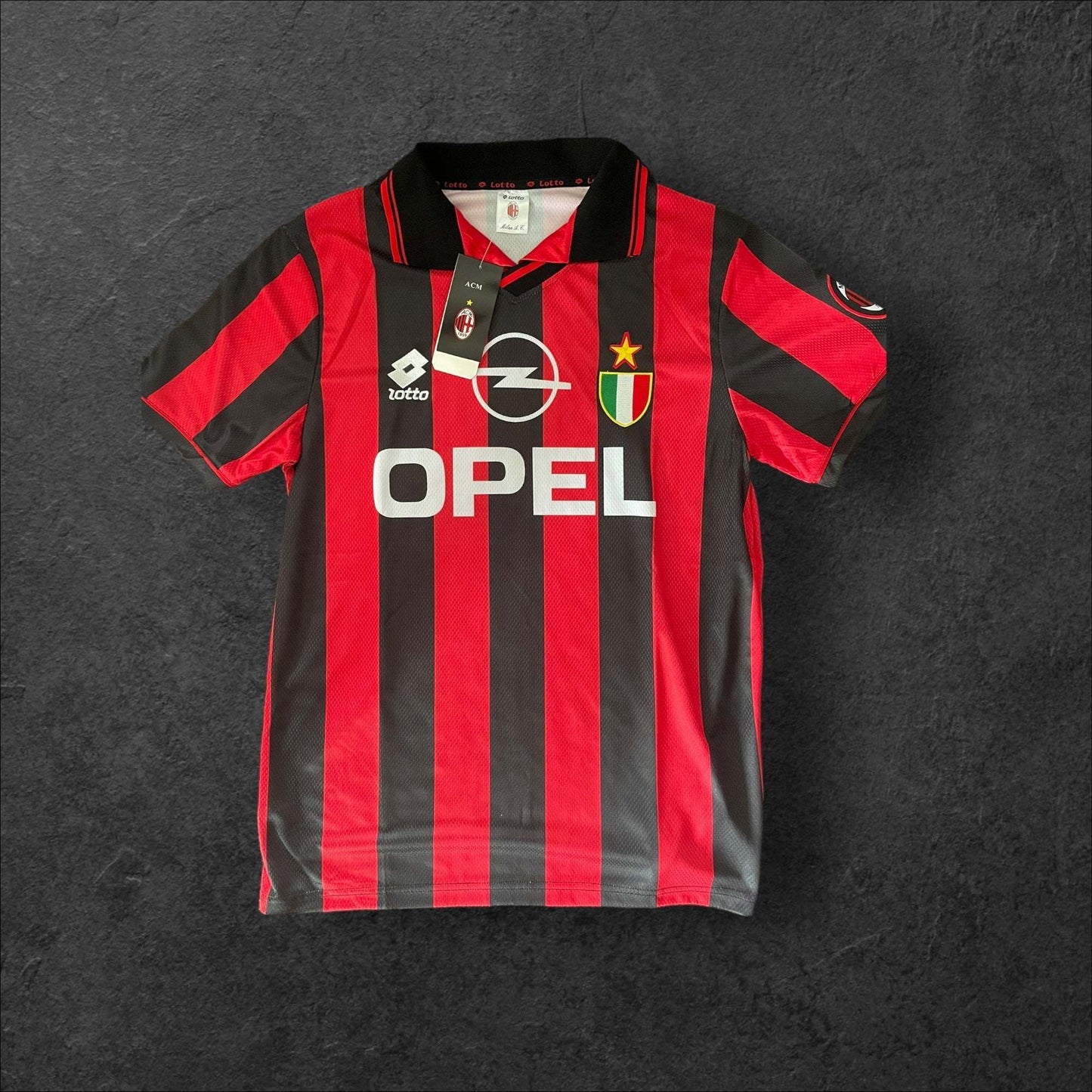 AC Milan Home 1996-97 jersey with red and black stripes and Opel logo.