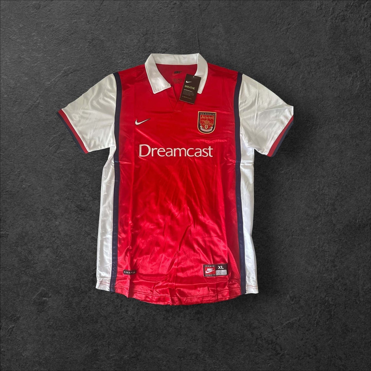 Arsenal Home 1999-00 football jersey with Dreamcast logo in vibrant red and white accents.