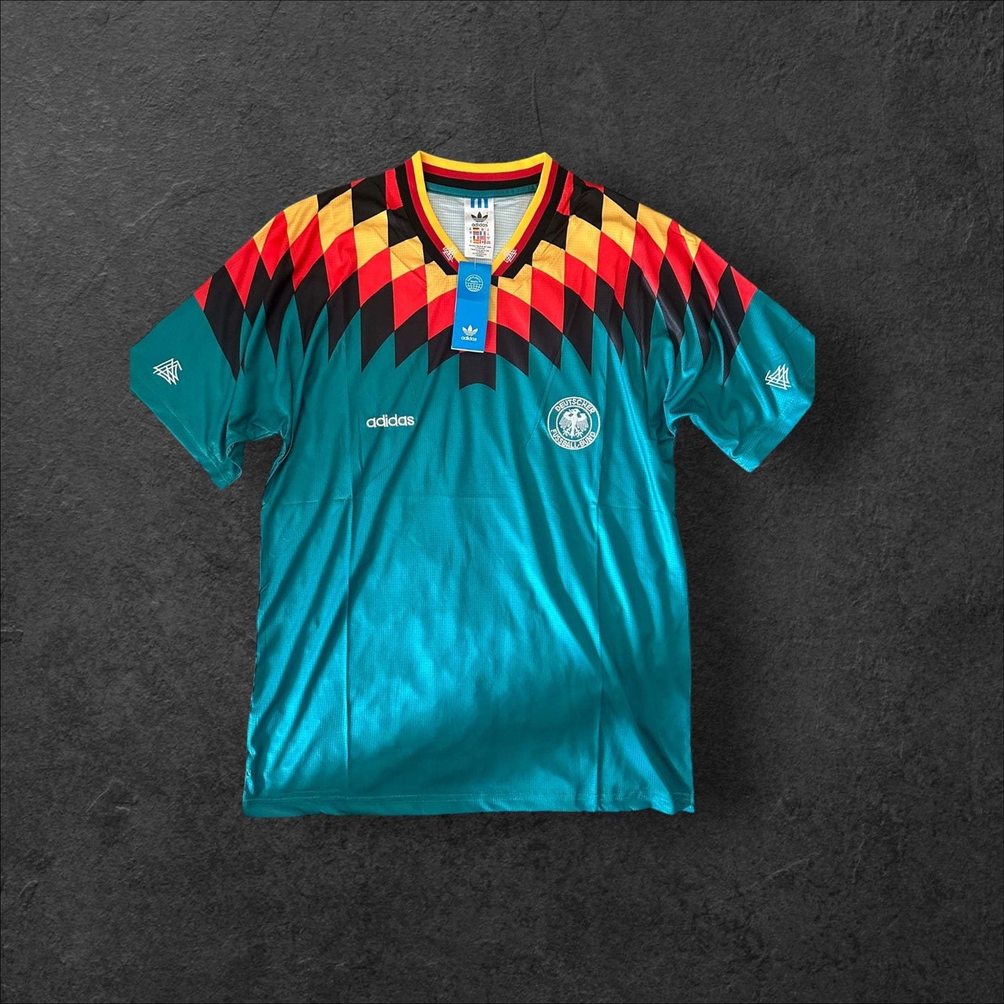 Germany Away 1994 Retro Soccer Jersey with black, red, and yellow design reflecting German flag colors.