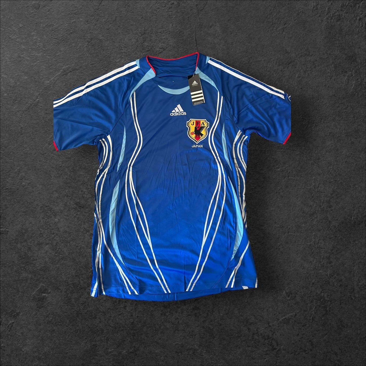 Japan Home 2006 Retro Soccer Jersey in blue with white and red accents.