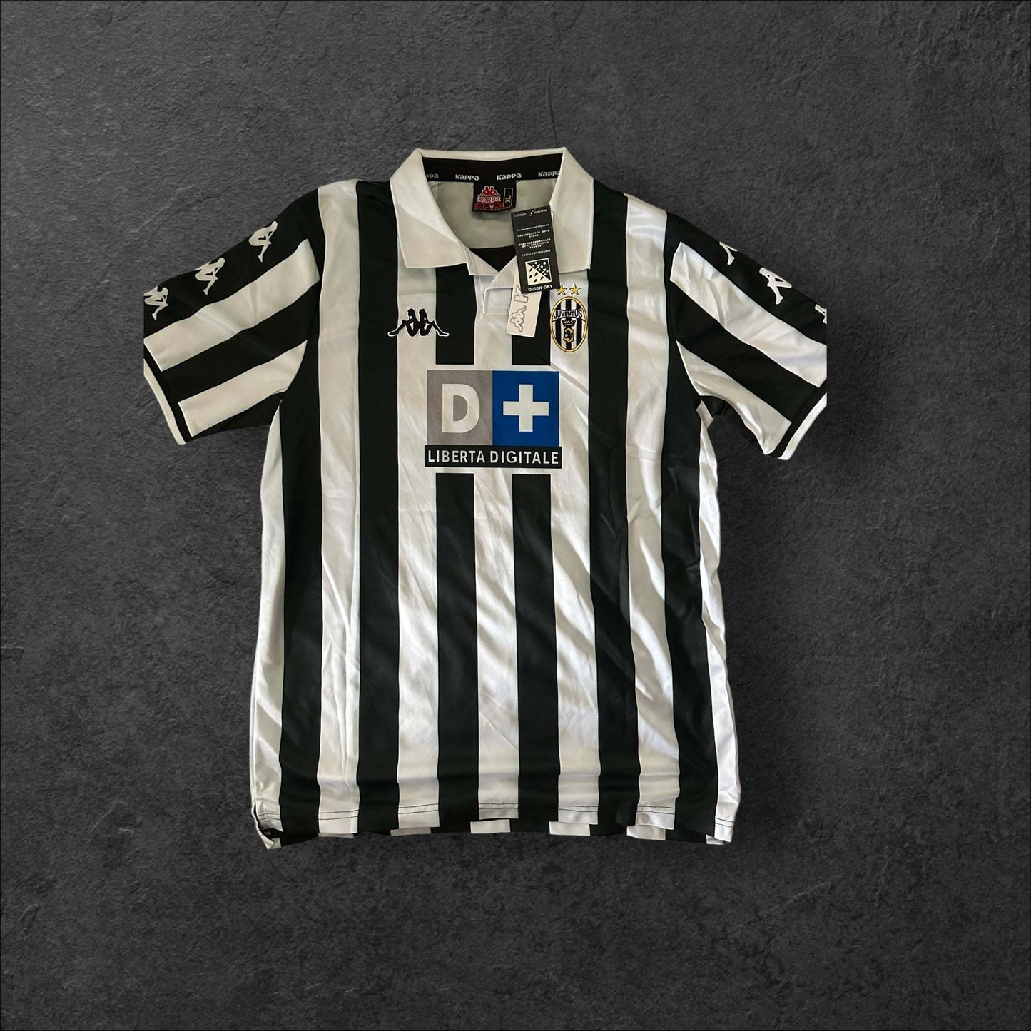 Juventus Home 1999-00 jersey featuring classic black and white stripes with Kappa logo.