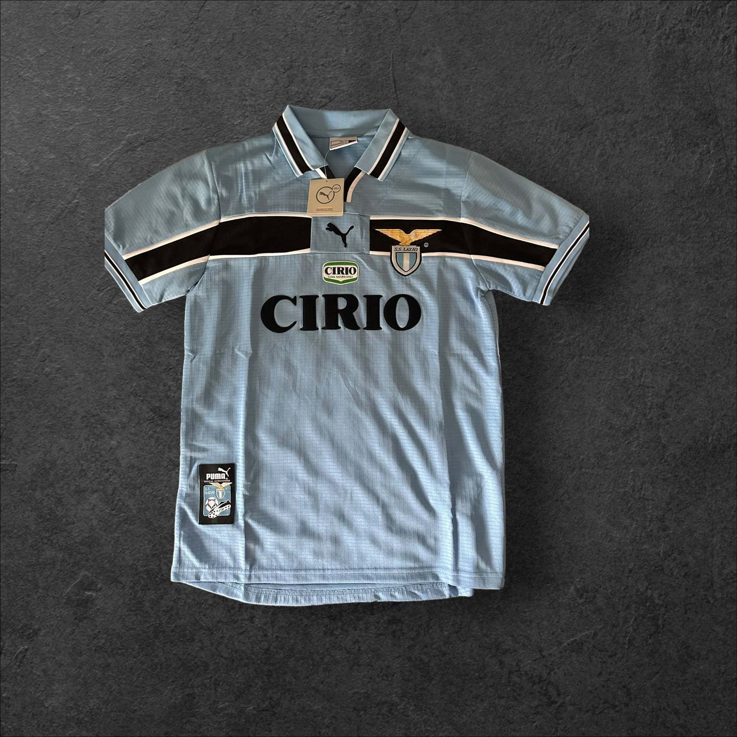 Lazio Home 1999-00 jersey with Cirio sponsorship and light blue color.