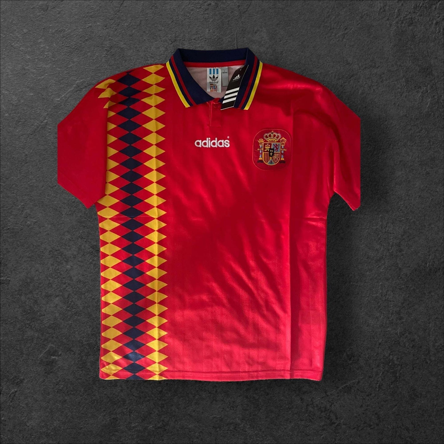 Spain Home 1994 Retro Soccer Jersey with red, yellow, and blue design reflecting the Spanish flag.